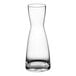 An Acopa clear glass carafe with a white background.