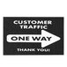 A close-up of a black and white E-Z Up square one way floor decal sign.