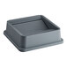 A Lavex gray plastic square trash can lid.