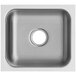 A close-up of a stainless steel undermount sink with a hole in the center.
