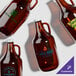 A group of Acopa customizable amber growlers with caps.