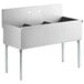 A stainless steel Regency utility sink with three compartments.