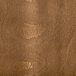 A close-up of a brown wood surface with a vintage finish.