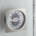 A Taylor 5504 indoor thermometer and hygrometer on a wall.