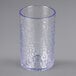 A Carlisle clear plastic tumbler with a blue rim.