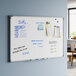 A wall-mounted magnetic whiteboard with an aluminum frame measuring 36 by 24 inches.