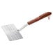 A stainless steel fish turner with a rosewood handle.