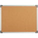 a cork board with a white frame