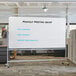 A Dynamic by 360 Office Furniture 96" x 48" Magnetic Whiteboard with Aluminum Frame and Mobile Stand with writing on it.