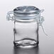 a glass jar with a metal lid