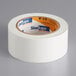 A roll of white Shurtape line set tape.