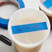 A container with a blue tape on it.