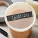 A white container with a black Shurtape label on it.