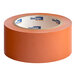 A roll of orange Shurtape VP 410 line set tape measuring 2 inches by 36 yards.