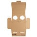 A Sabert cardboard insert with two holes.