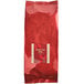 A red bag of Bossen Black Loose Leaf Tea with a red label.