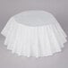 A white tablecloth on a table with a Bunn urn style coffee filter package.