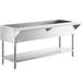 A stainless steel ServIt cold food table with an undershelf.