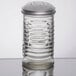 A Tablecraft glass beehive cheese shaker with a stainless steel top with holes.