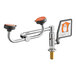 A close-up of a Guardian Equipment deck mounted eye and face wash station with a chrome faucet and hose.