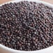 A bowl of brown Regal black mustard seeds.