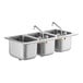 A Regency stainless steel drop-in sink with three compartments and two faucets.