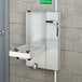 A metal box with a Guardian Equipment eye wash station inside.