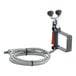 A wall-mounted eyewash station with a drench hose and backflow preventer.