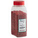 A plastic container of Regal Pink Peppercorns with red peppercorns.