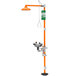 An orange and green Guardian Equipment safety station with a shower.