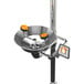 A close-up of a polished chrome Guardian Equipment safety station with eye and face wash.