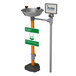 A Guardian Equipment pedestal mounted eye wash station with stainless steel bowl.