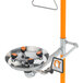 A Guardian Equipment safety station with orange handles and a round metal shower head.