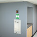 A Guardian recess mounted eye and face wash station with a door and a sign above it.