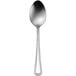 A silver spoon with a black handle.