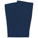 A folded navy blue cloth napkin on a white background.