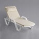 A white Lancaster Table & Seating chaise lounge with a cream pillow