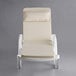 A white Lancaster Table & Seating chaise with a cream cushion and pillow on it.