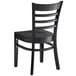 A Lancaster Table & Seating black wooden chair with a wooden back and black seat.