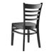 A Lancaster Table & Seating black wood ladder back chair with a wooden back and seat.