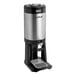 A silver and black Fetco Luxus coffee dispenser with a water dispenser.