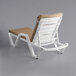 A white Lancaster Table & Seating chaise lounge with beige cushion and pillow.