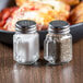 a salt and pepper shakers on a table