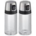 Two glass OXO salt and pepper shakers with black handles.