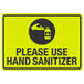 A yellow sign with black text that says "Please Use Hand Sanitizer" and a hand symbol