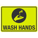 A yellow and black aluminum sign with a hand and faucet above the words "Wash Hands" in black text.