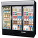 A Beverage-Air black three section refrigerator with glass doors filled with drinks and yogurt.