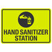 A yellow sign with a hand sanitizer and a hand in a circle.