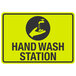 A yellow and black sign with a hand and a faucet that says "Hand Wash Station"