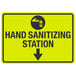 A yellow and black sign with black text and a black arrow that says "Hand Sanitizing Station" with a hand and bottle symbol.